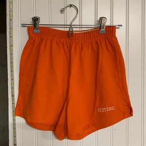 Orange mini “hooters” shorts